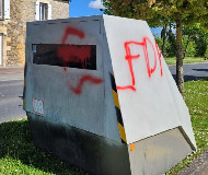 Red spraypaint on French speed camera