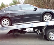 Altima on a tow truck