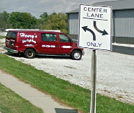 Center turn lane sign via Google Maps